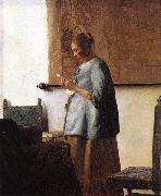 Woman in Blue Reading a Letter